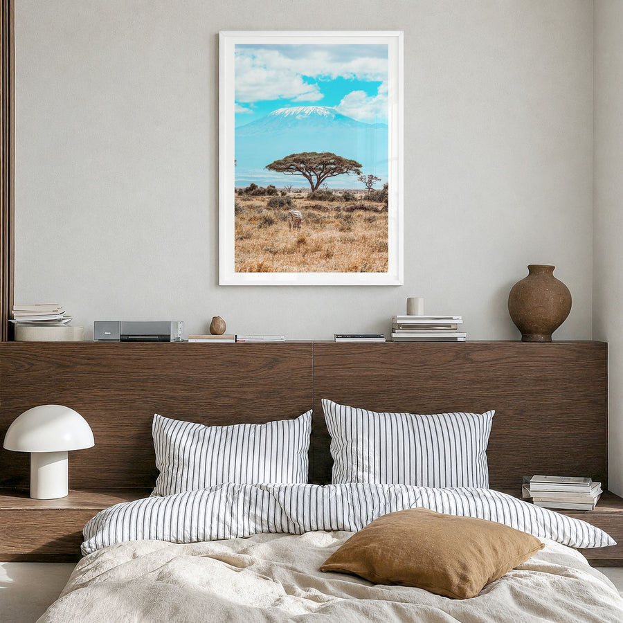 Kenya Photo Poster in a white wood frame, hanging in a bedroom, white border