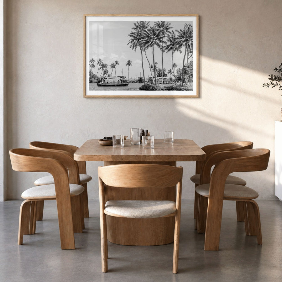 Kerala Photo Poster in a natural wood frame, hanging in a dining room, white border