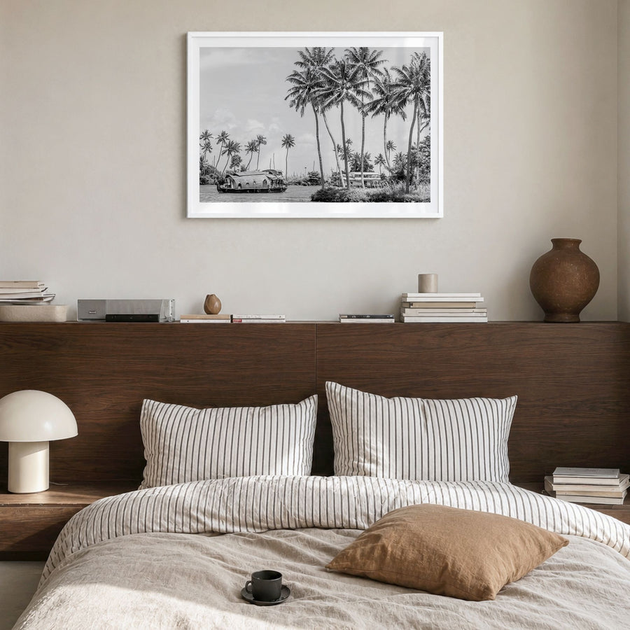 Kerala Photo Poster in a white wood frame, hanging in a bedroom, white border