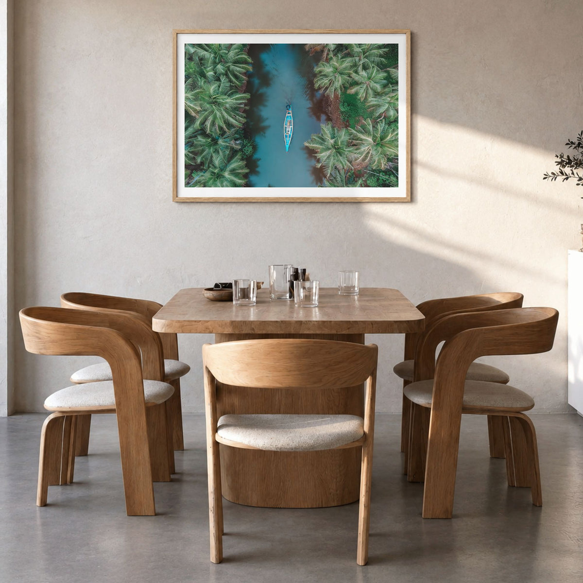 Kerala Photo Poster in a natural wood frame, hanging in a dining room, white border