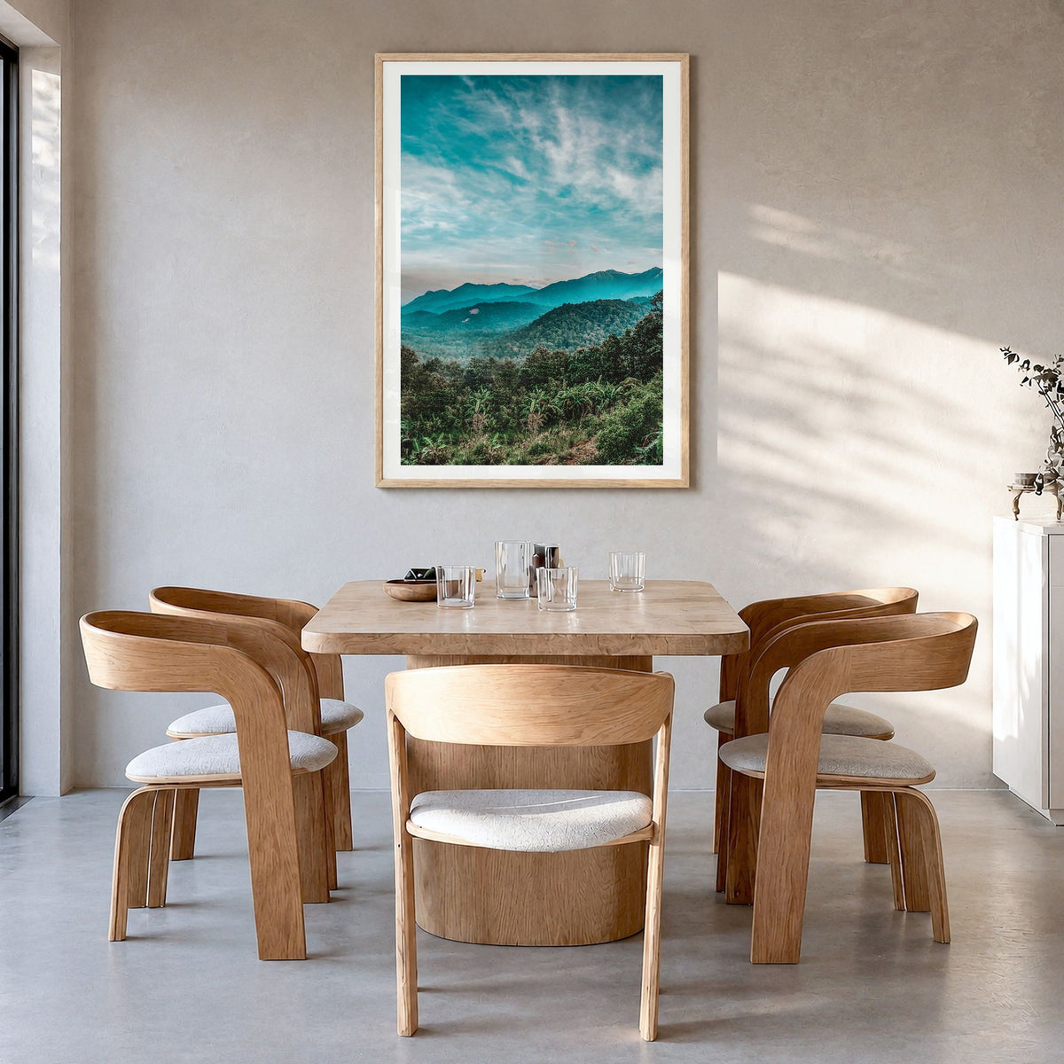 Kerala Photo Poster in a natural wood frame, hanging in a dining room, white border