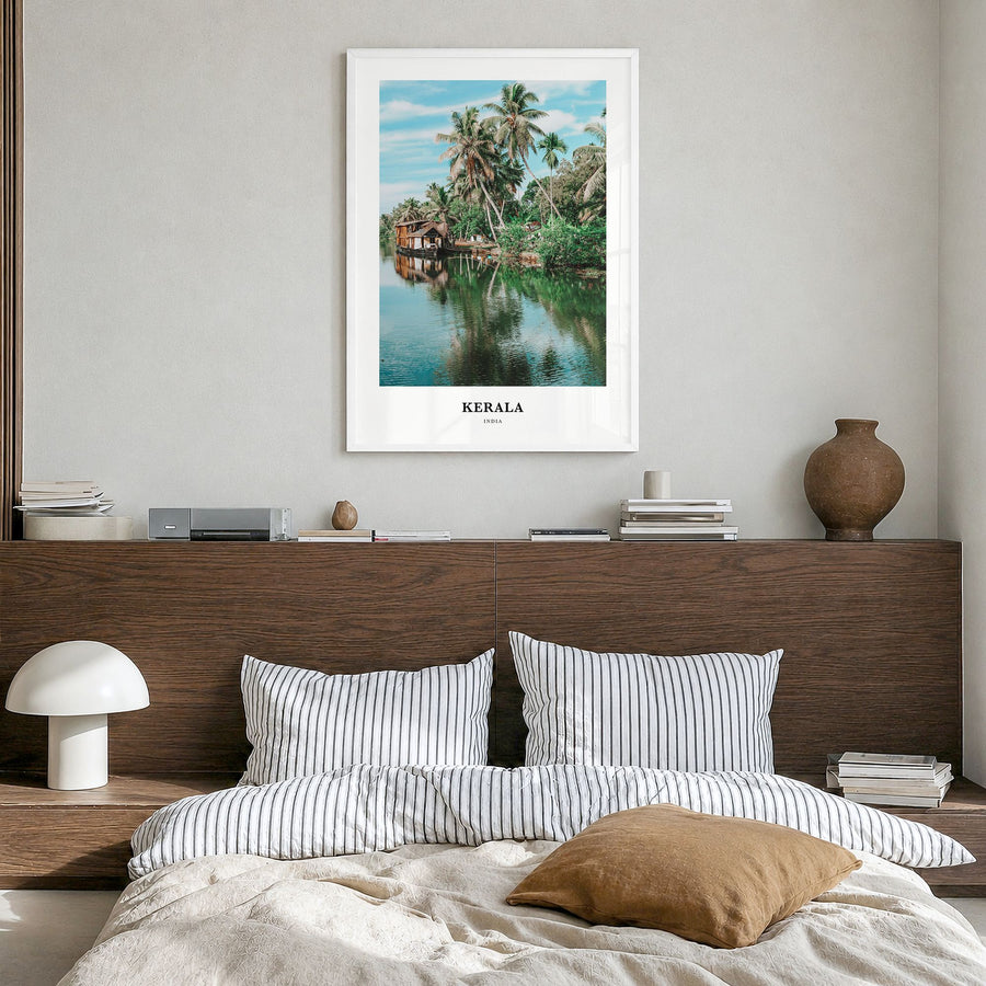 Kerala Classic Poster in a white wood frame, hanging in a bedroom
