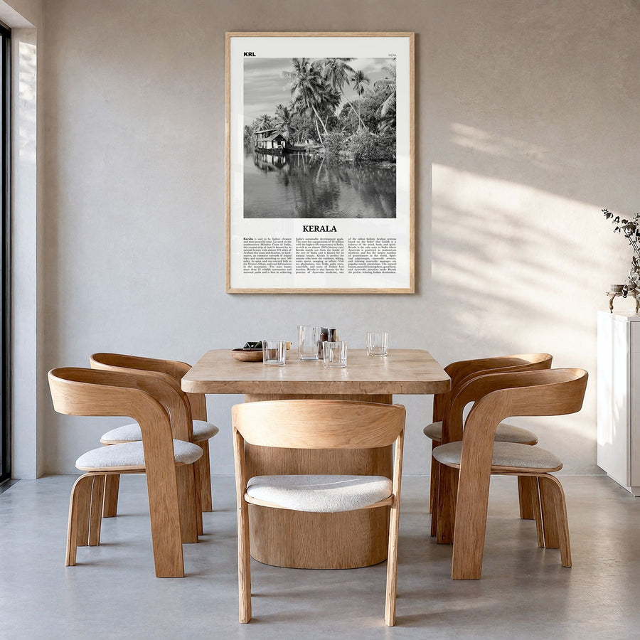 Kerala Newspaper Poster in a natural wood frame, hanging in a dining room
