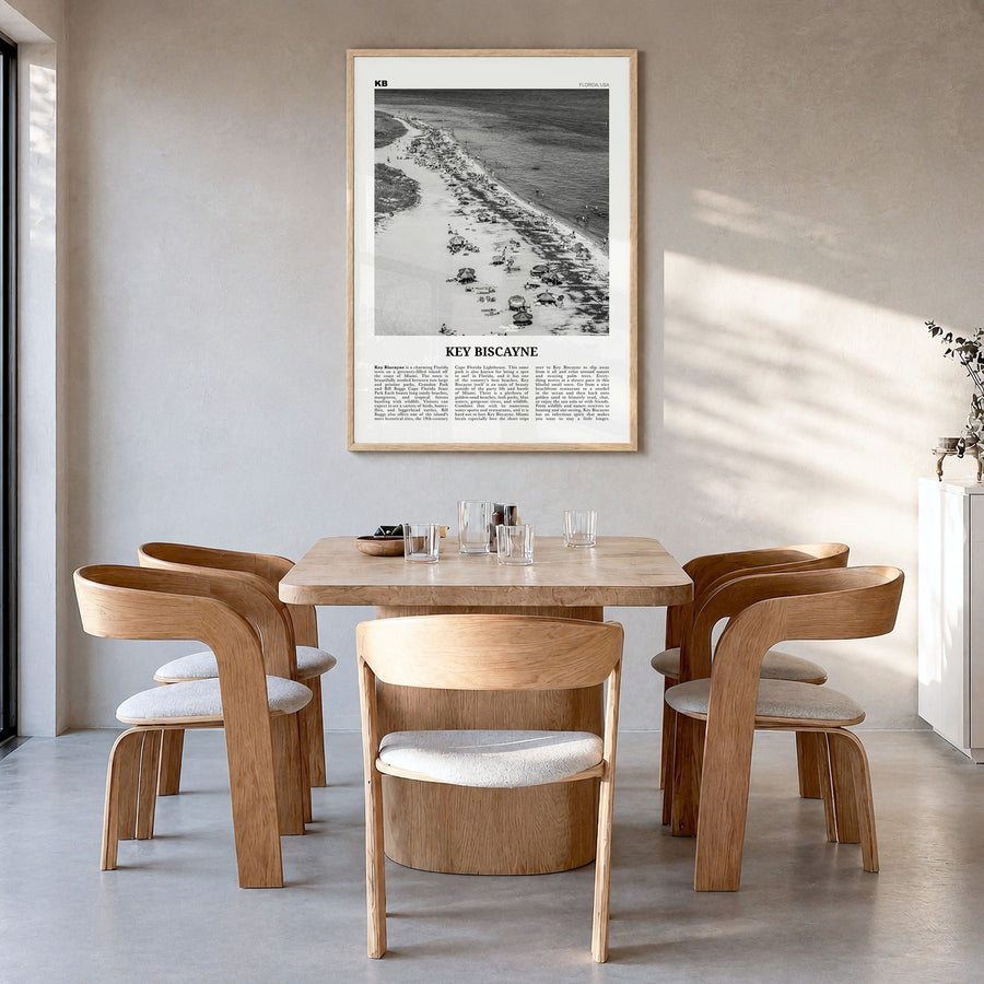 Key Biscayne Newspaper Poster in a natural wood frame, hanging in a dining room
