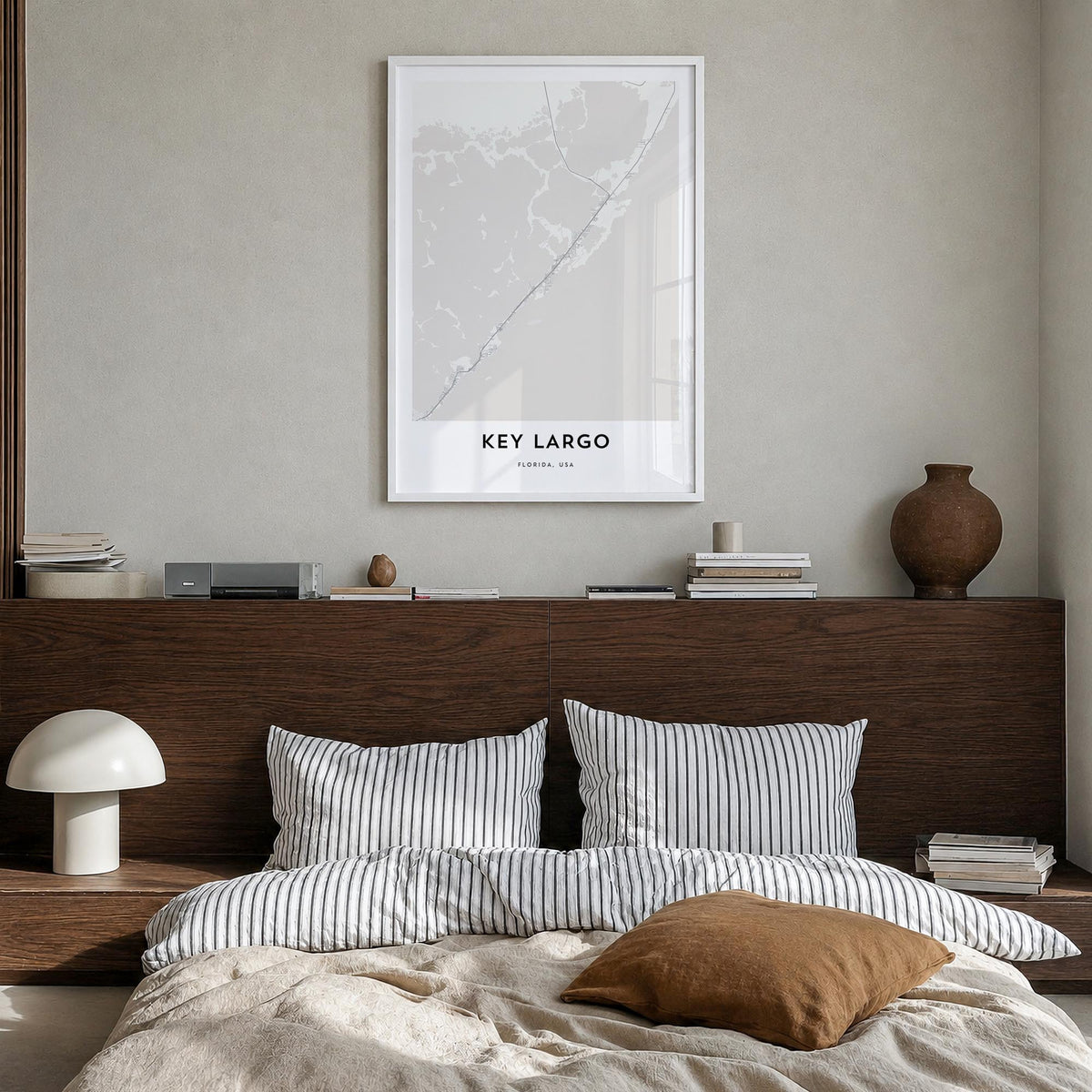 Key Largo black & white map poster of Florida, USA – vertical wall art in white wood frame, hanging on wall