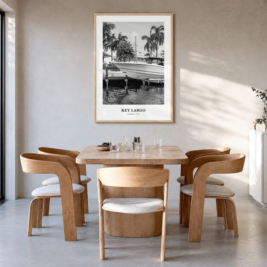 Key Largo Classic Poster in a natural wood frame, hanging in a dining room