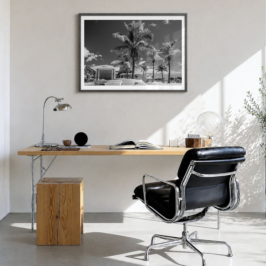 Key West Photo Poster in a black wood frame, hanging in a bright home office, white border