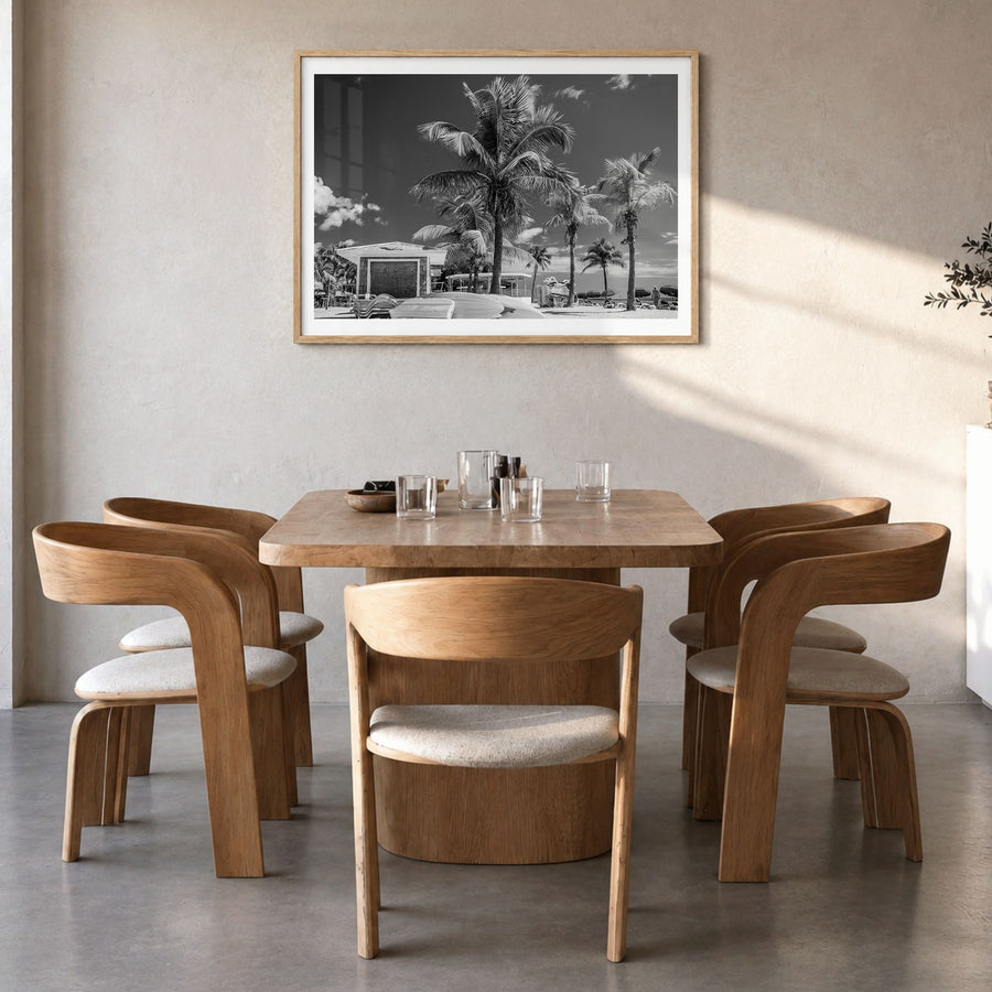 Key West Photo Poster in a natural wood frame, hanging in a dining room, white border