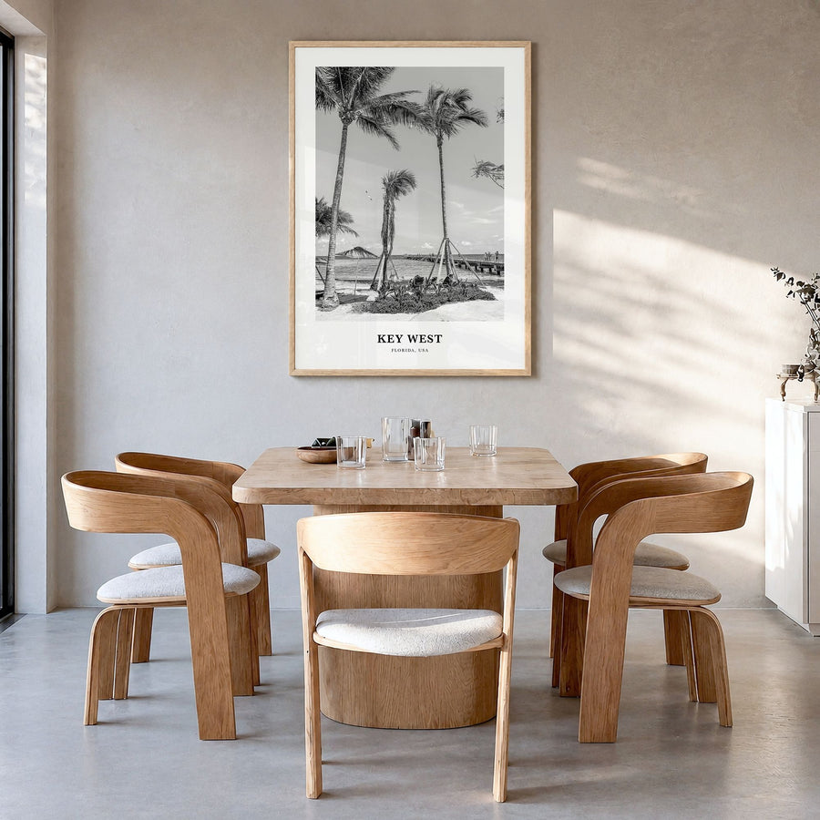 Key West Classic No 1 Poster in a natural wood frame, hanging in a dining room