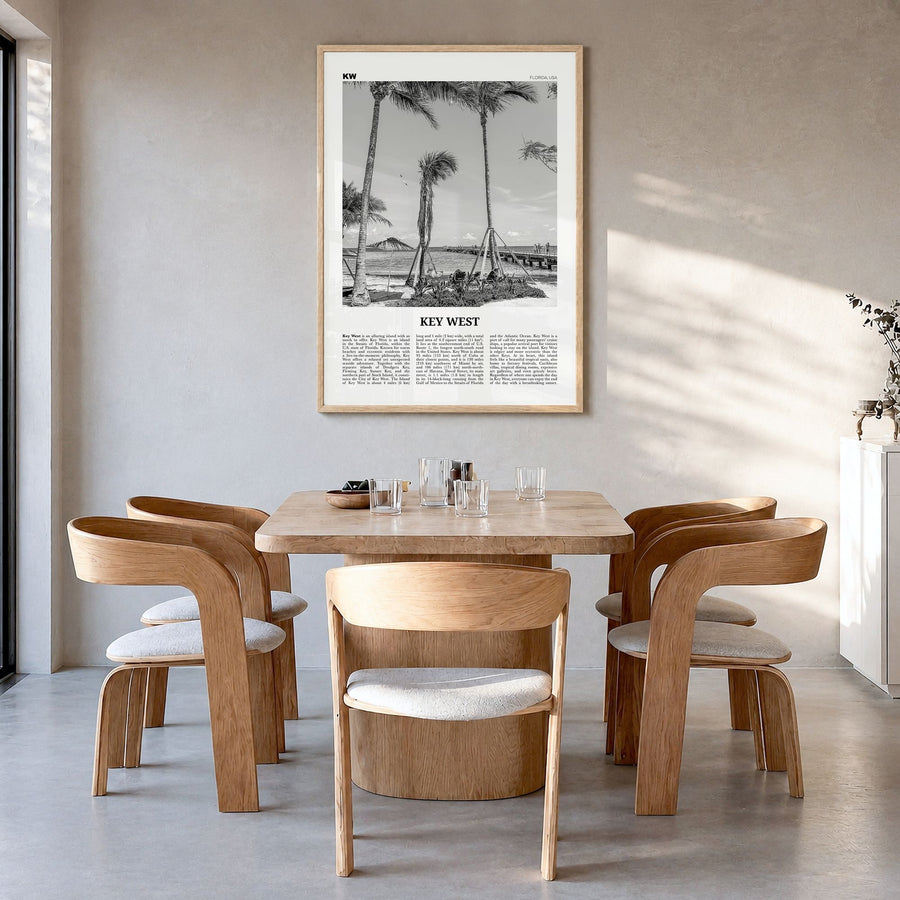 Key West Newspaper No 1 Poster in a natural wood frame, hanging in a dining room