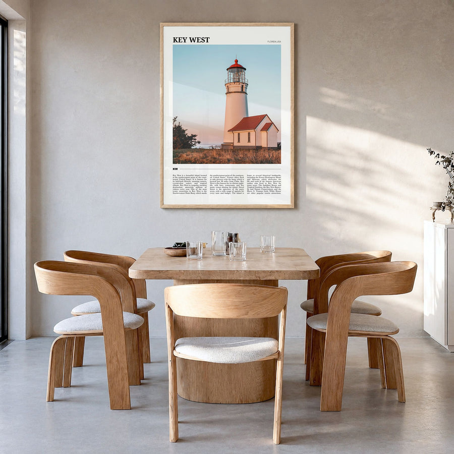Key West Travel Poster in a natural wood frame, hanging in a dining room