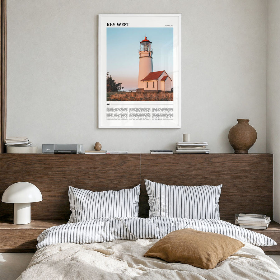 Key West Travel Poster in a white wood frame, hanging in a bedroom