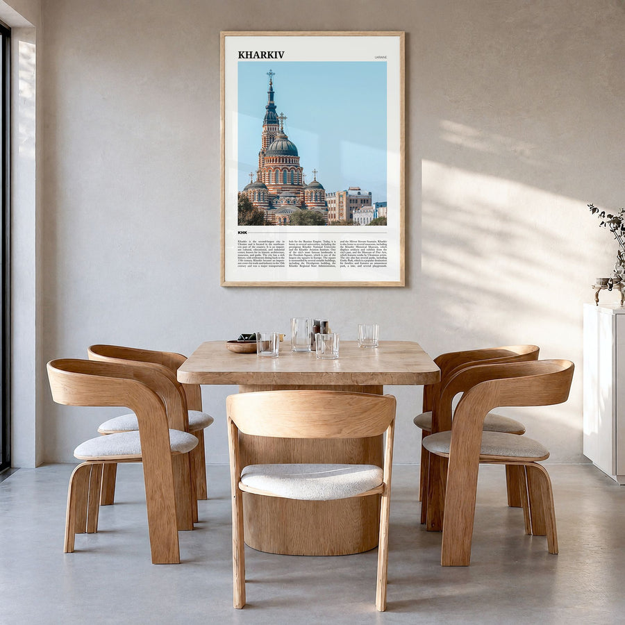 Kharkiv Travel Poster in a natural wood frame, hanging in a dining room