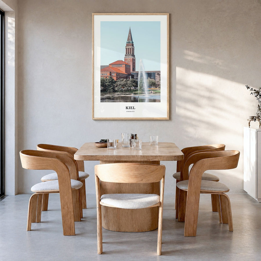 Kiel Classic Poster in a natural wood frame, hanging in a dining room