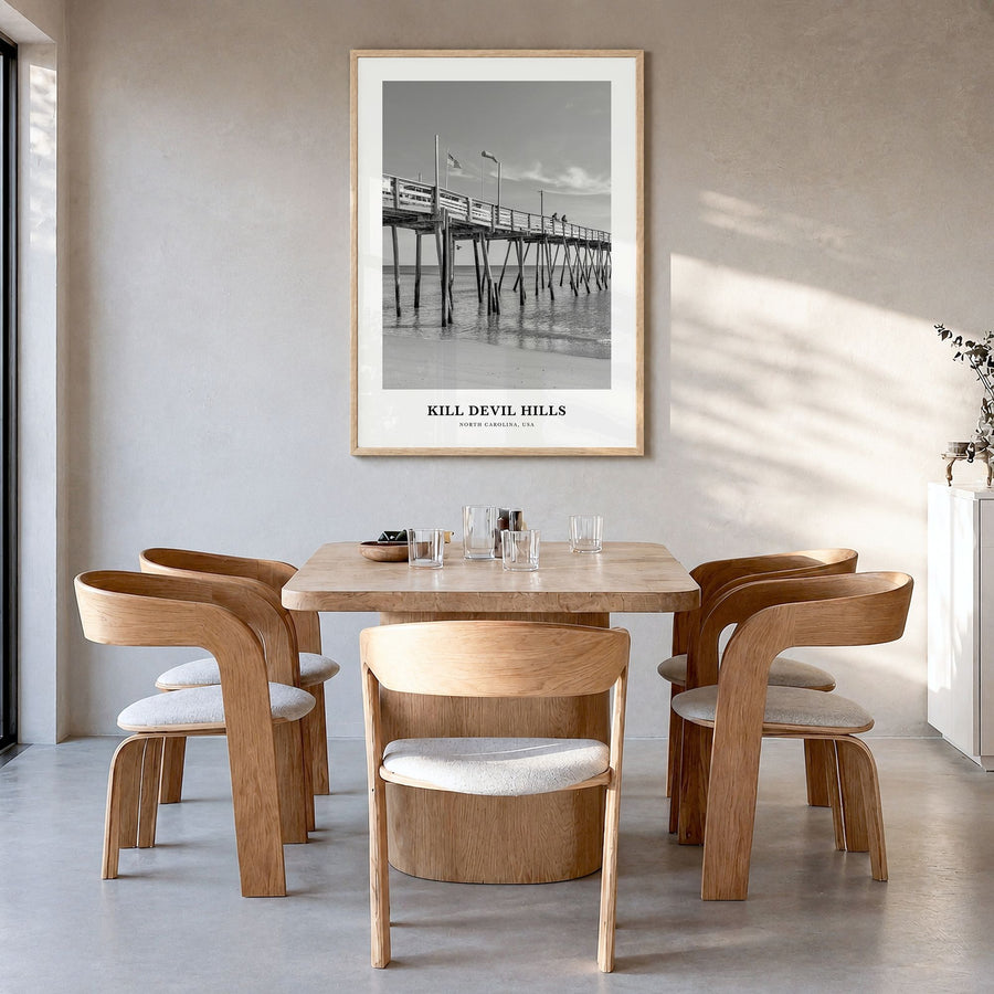 Kill Devil Hills Classic Poster in a natural wood frame, hanging in a dining room
