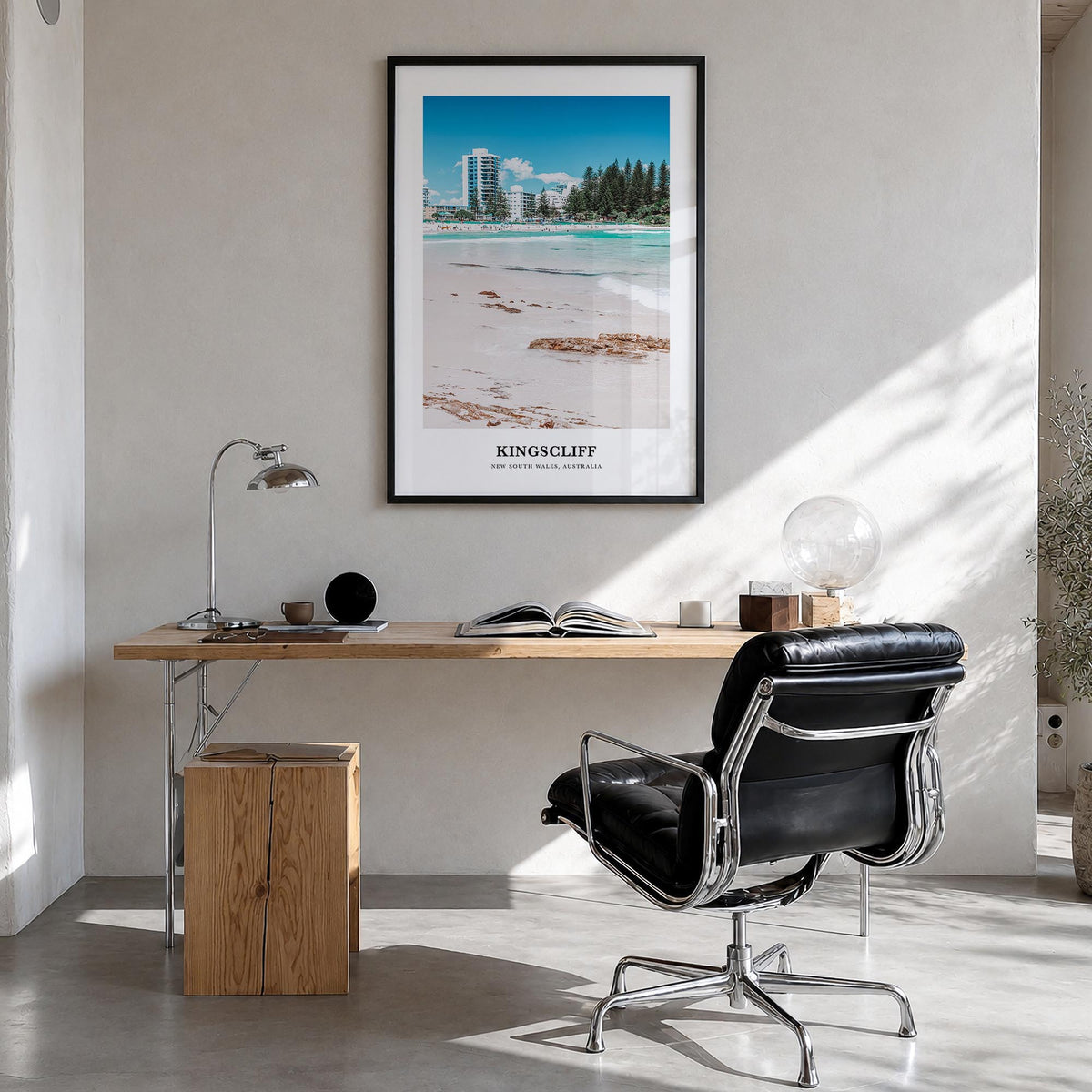 Kingscliff colorful classic poster of Australia – vertical wall art in black wood frame, hanging on wall
