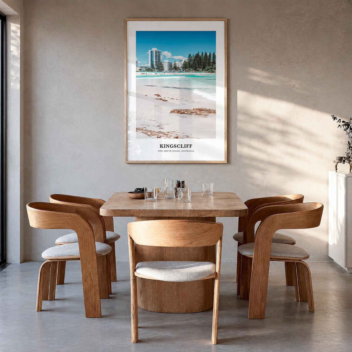 Kingscliff colorful classic poster of Australia – vertical wall art in natural wood frame, hanging on wall