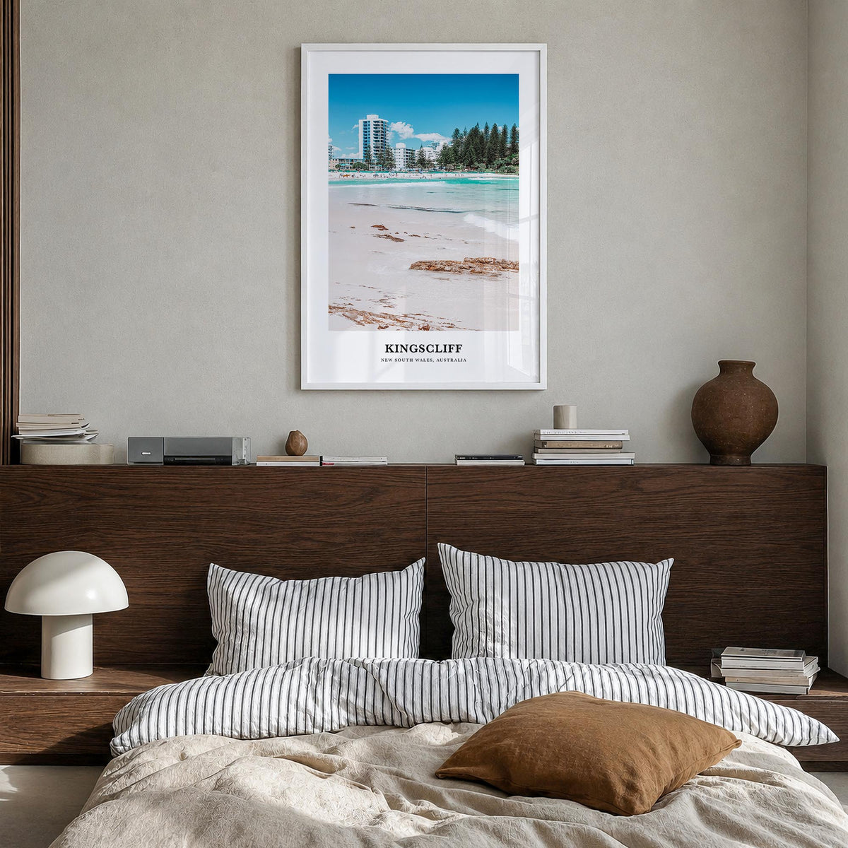 Kingscliff colorful classic poster of Australia – vertical wall art in white wood frame, hanging on wall