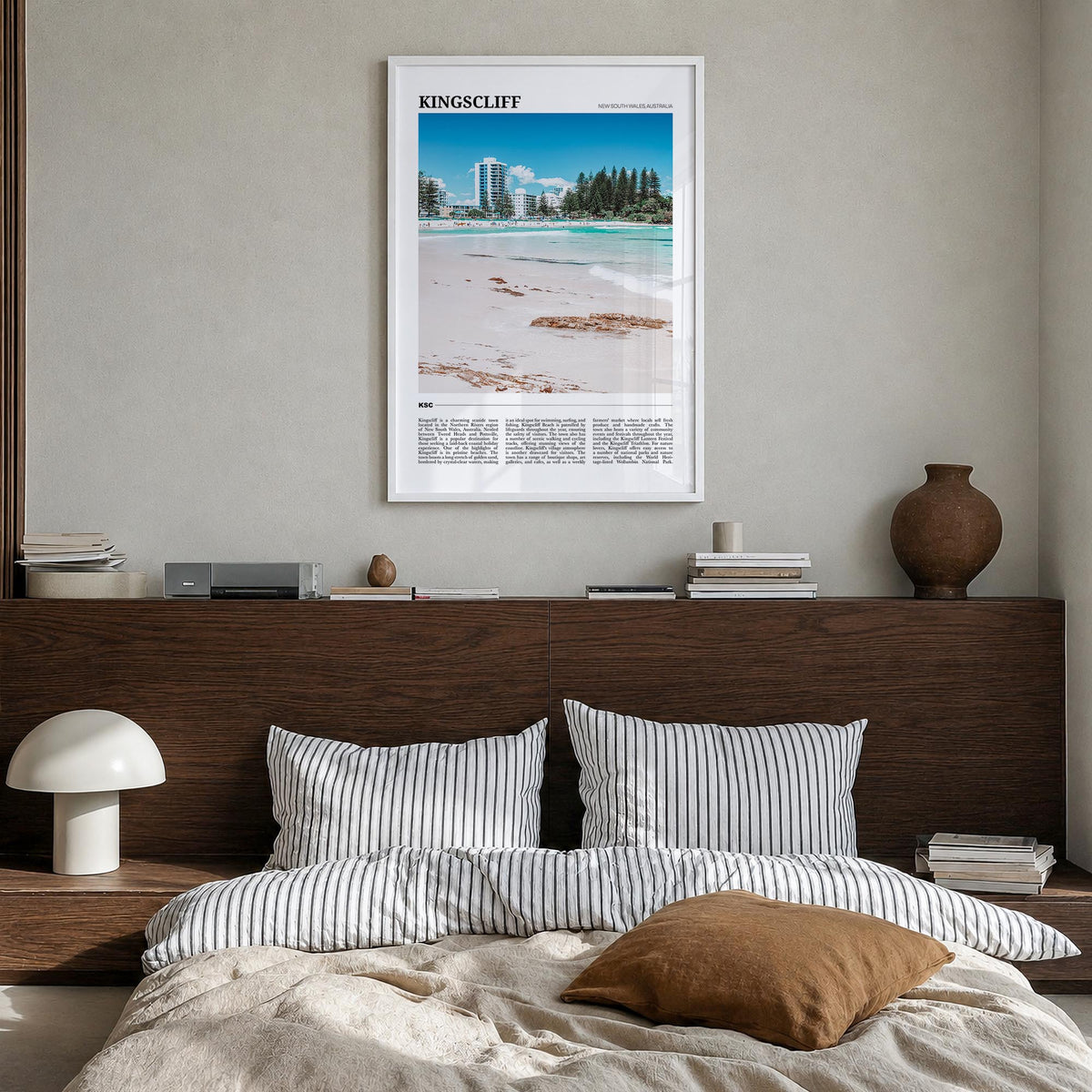 Kingscliff colorful travel poster of Australia – vertical wall art in white wood frame, hanging on wall