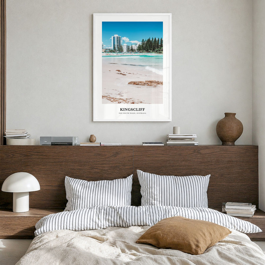 Kingscliff Classic Poster in a white wood frame, hanging in a bedroom