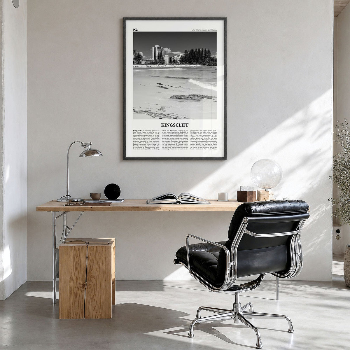 Kingscliff Newspaper Poster in a black wood frame, hanging in a bright home office