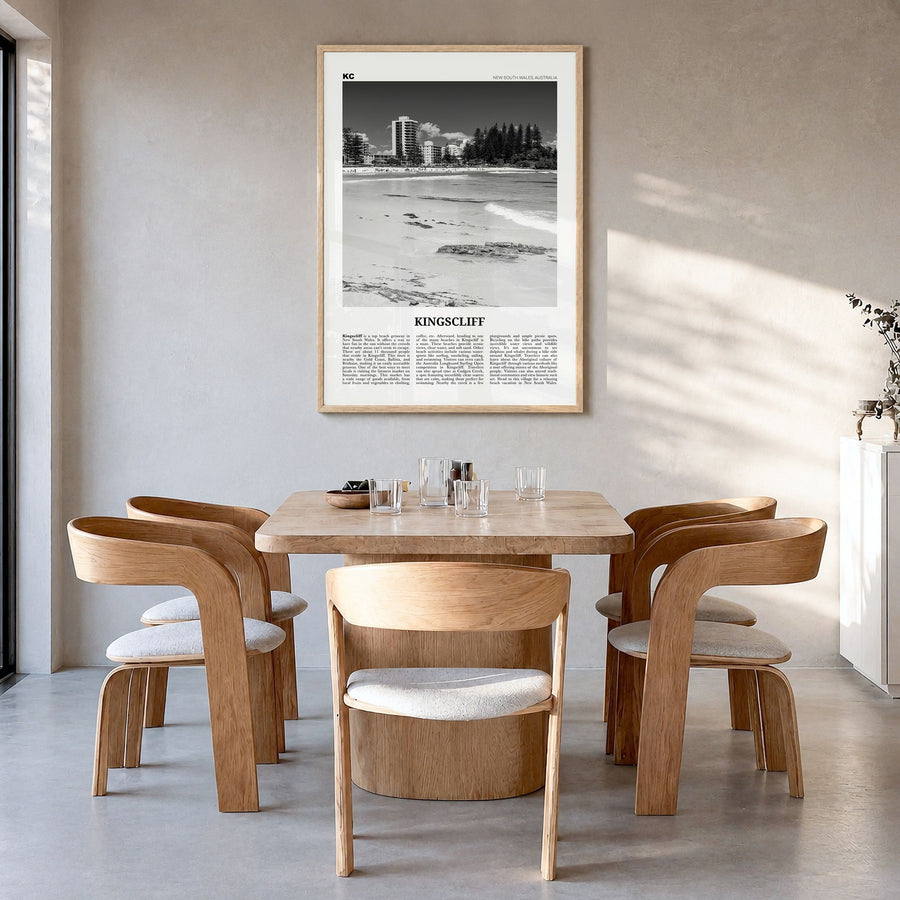 Kingscliff Newspaper Poster in a natural wood frame, hanging in a dining room