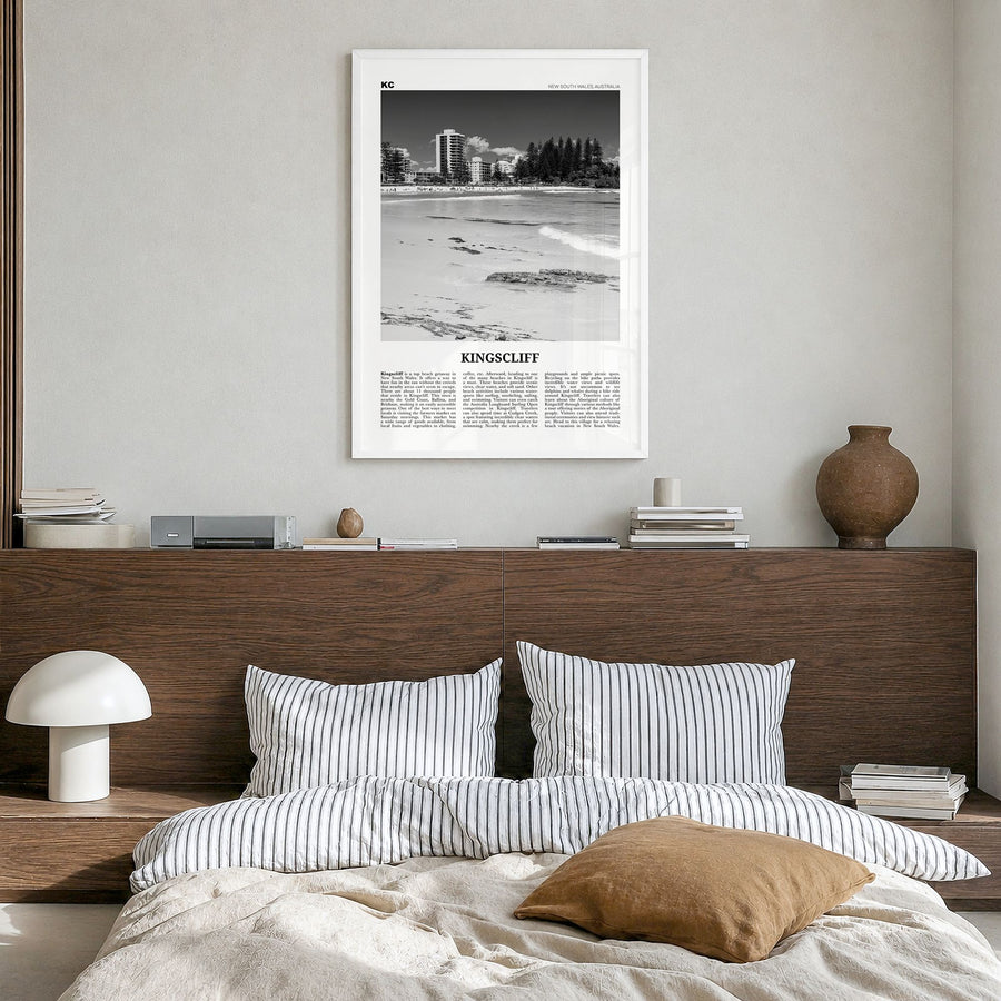 Kingscliff Newspaper Poster in a white wood frame, hanging in a bedroom