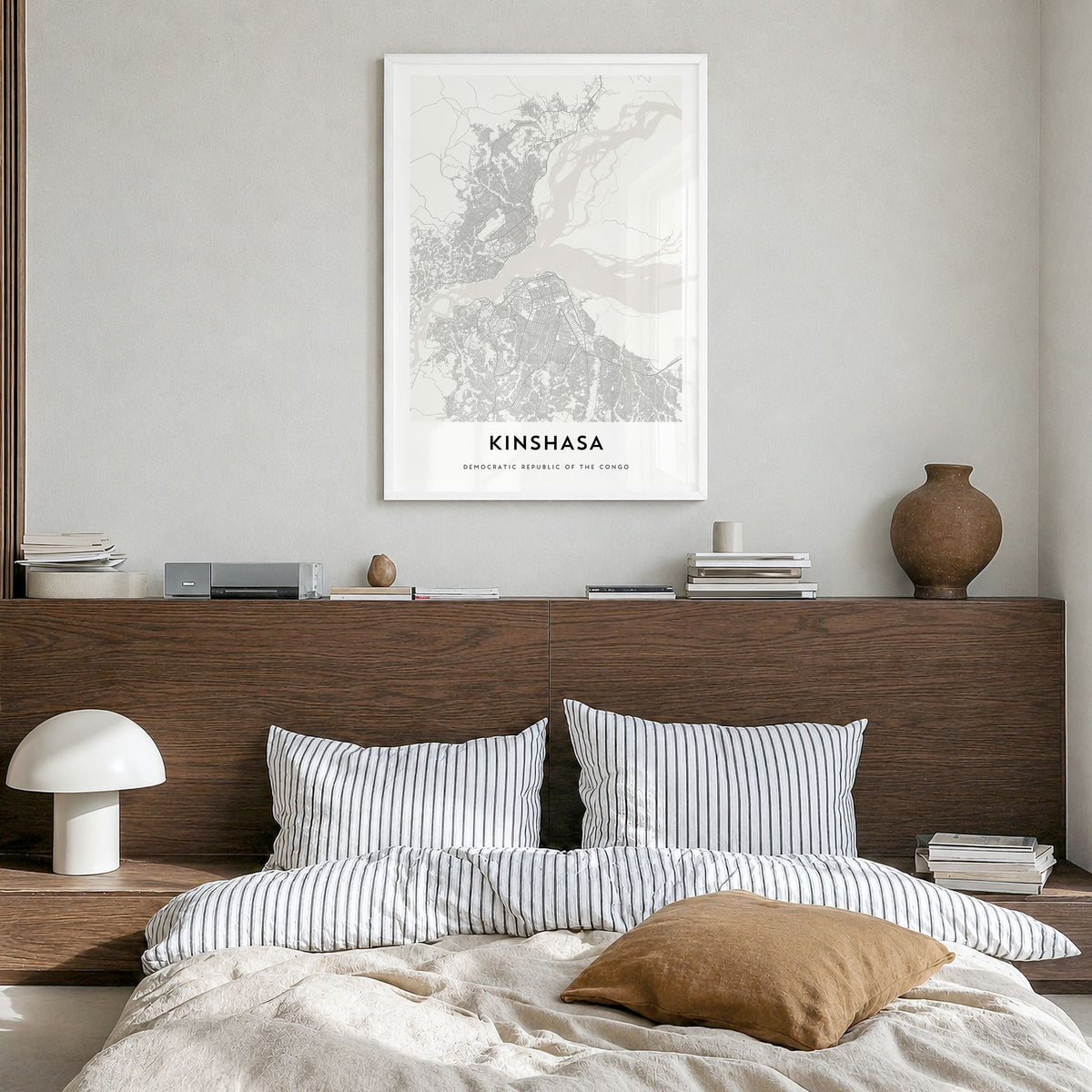 Kinshasa Map Poster in a white wood frame, hanging in a bedroom