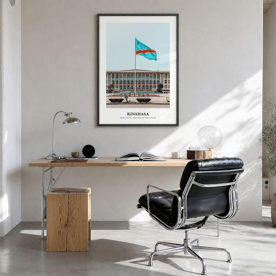 Kinshasa Classic Poster in a black wood frame, hanging in a bright home office