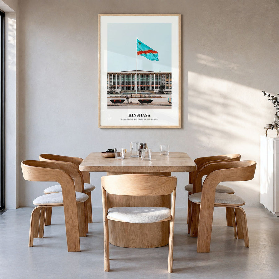 Kinshasa Classic Poster in a natural wood frame, hanging in a dining room