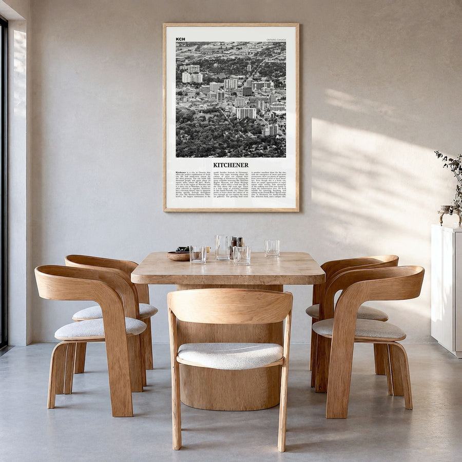 Kitchener Newspaper Poster in a natural wood frame, hanging in a dining room