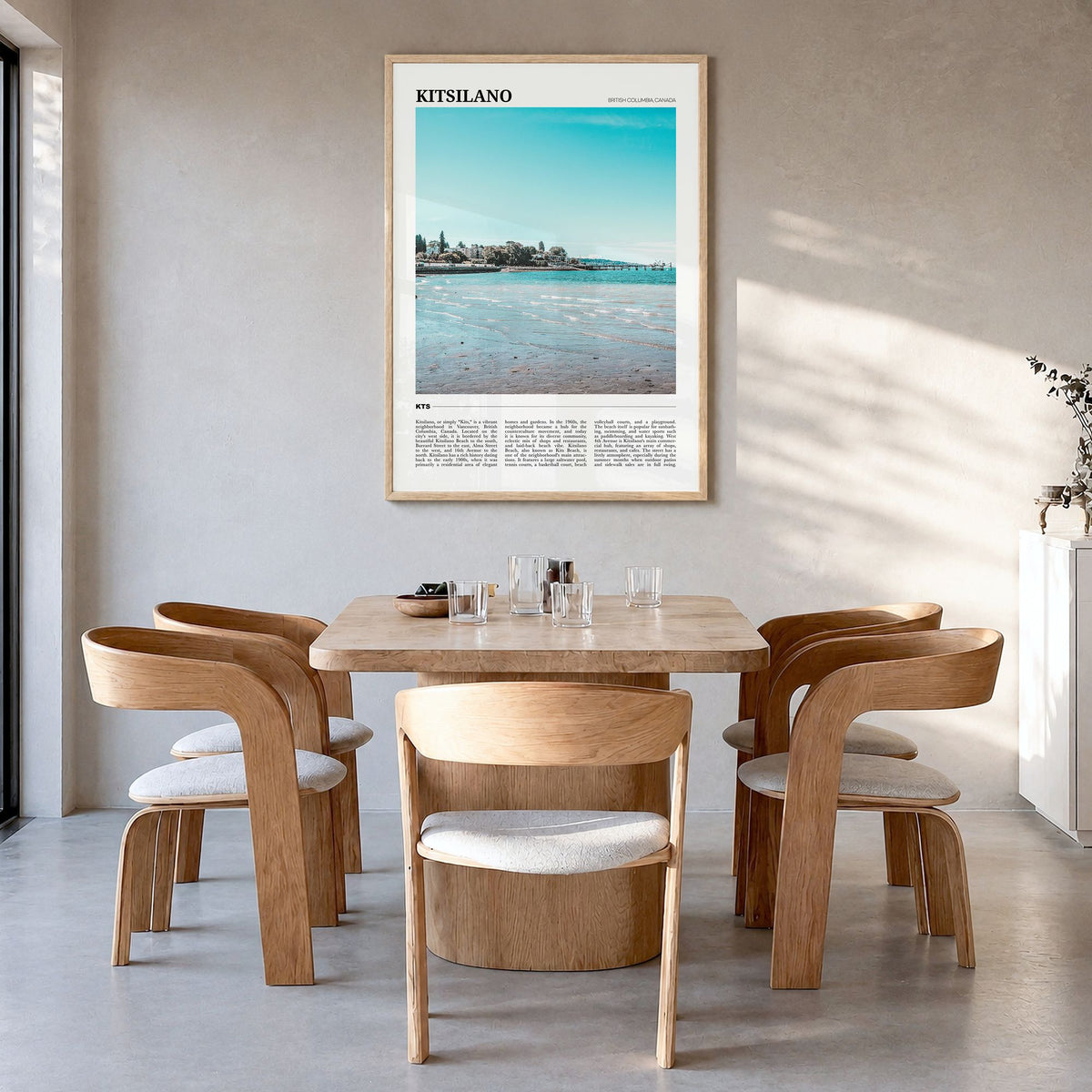 Kitsilano Travel Poster in a natural wood frame, hanging in a dining room