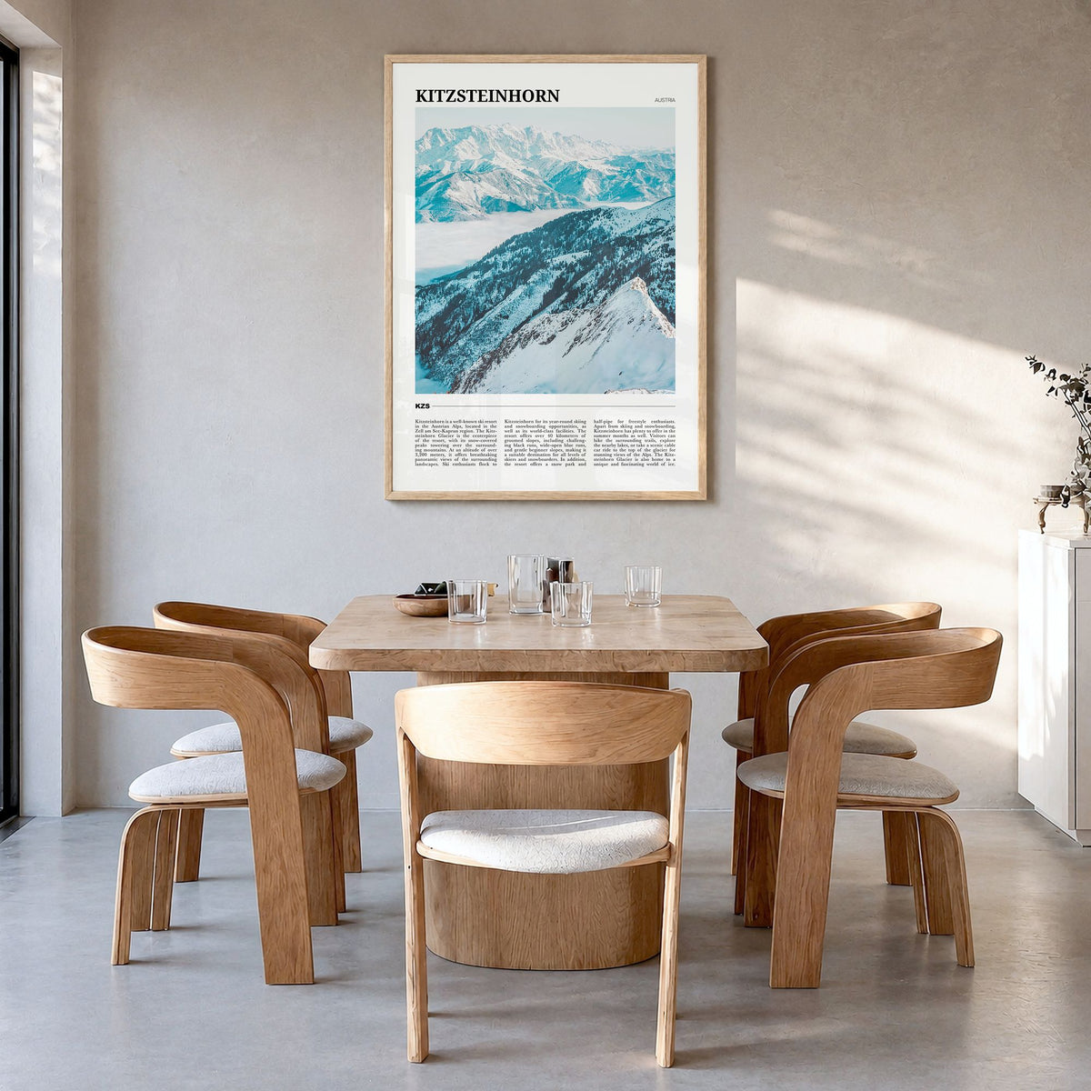 Kitzsteinhorn Travel Poster in a natural wood frame, hanging in a dining room
