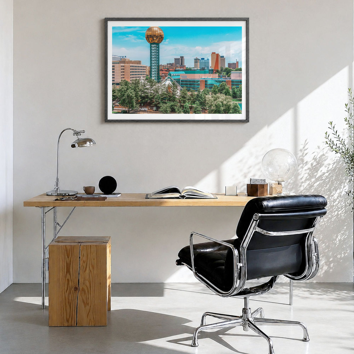 Knoxville Photo Poster in a black wood frame, hanging in a bright home office, white border