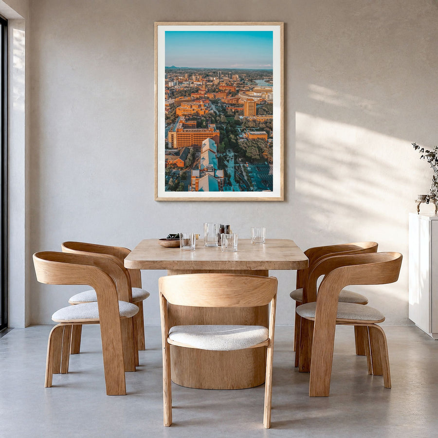 Knoxville Photo No 2 Poster in a natural wood frame, hanging in a dining room, white border