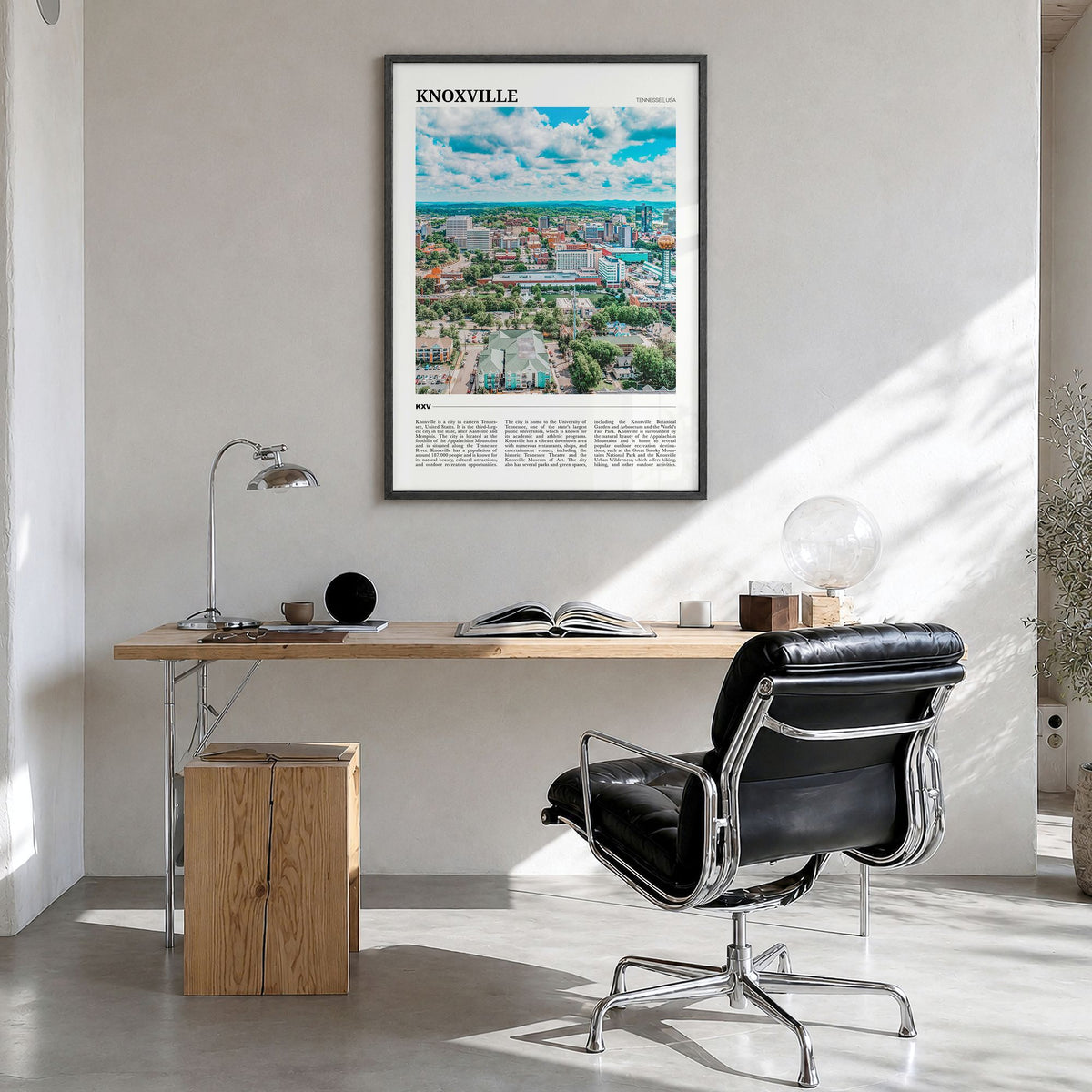 Knoxville Travel Poster in a black wood frame, hanging in a bright home office