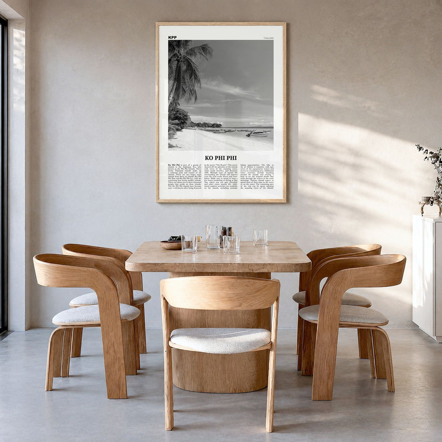 Ko Phi Phi Newspaper Poster in a natural wood frame, hanging in a dining room