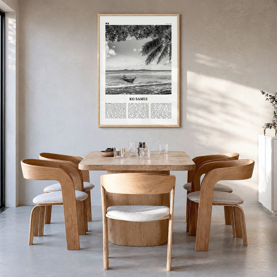 Ko Samui Newspaper Poster in a natural wood frame, hanging in a dining room