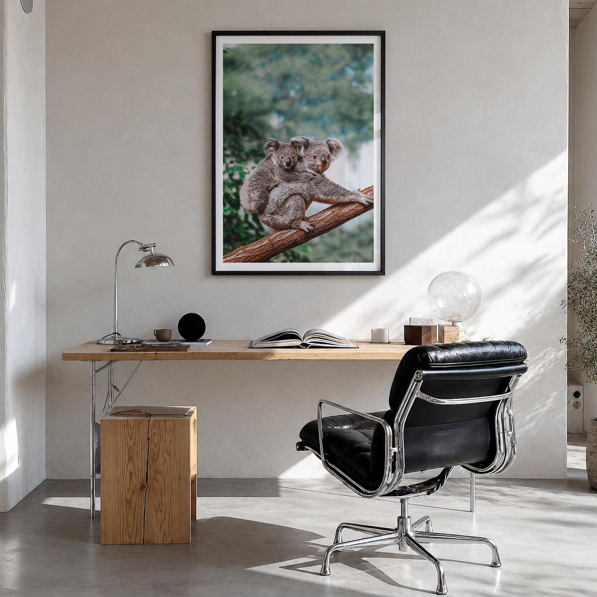 Koala colorful photo poster – vertical wall art in black wood frame with white border, hanging on wall