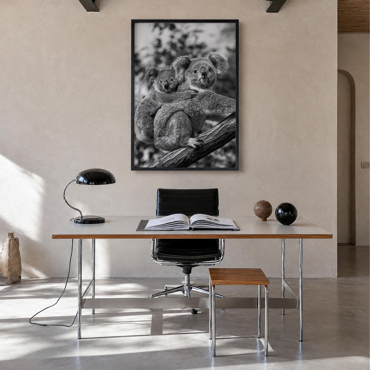 Koala no. 1 black & white photo poster – vertical wall art in black wood frame, hanging on wall