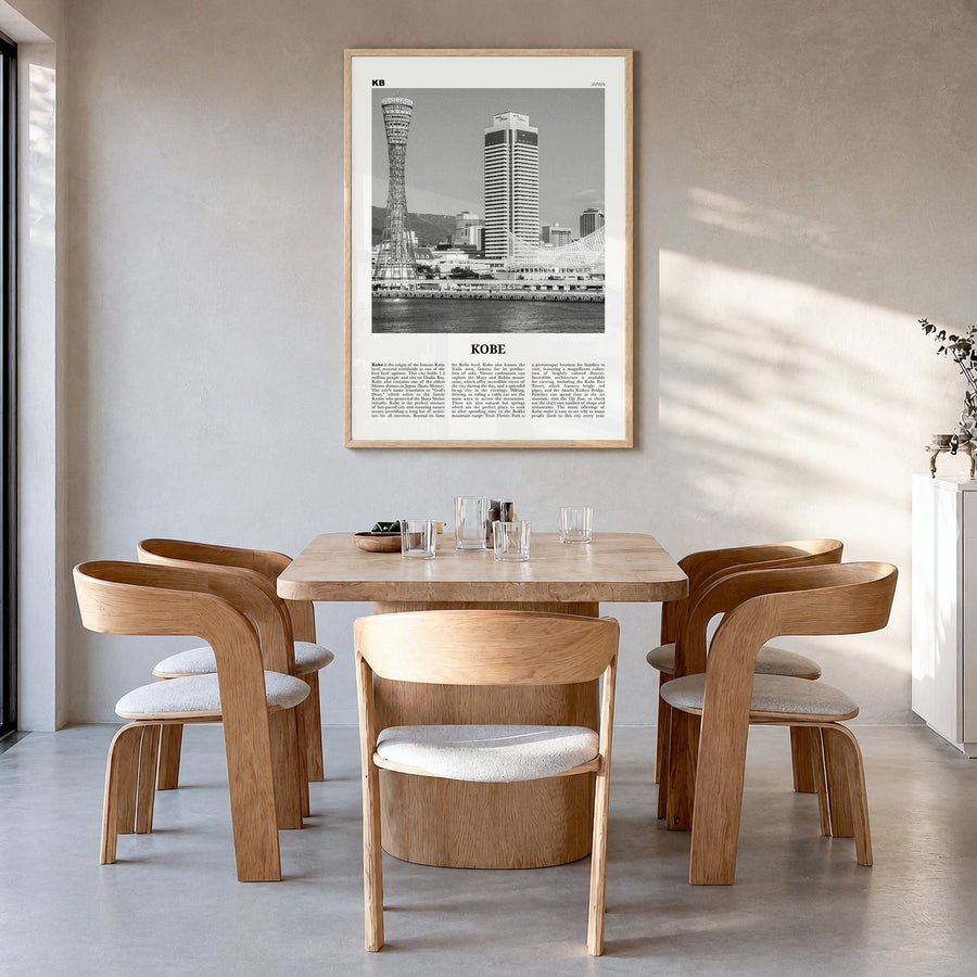 Kobe Newspaper Poster in a natural wood frame, hanging in a dining room
