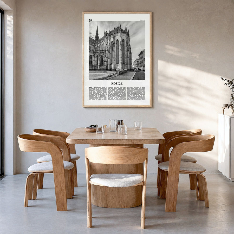 Košice Newspaper Poster in a natural wood frame, hanging in a dining room