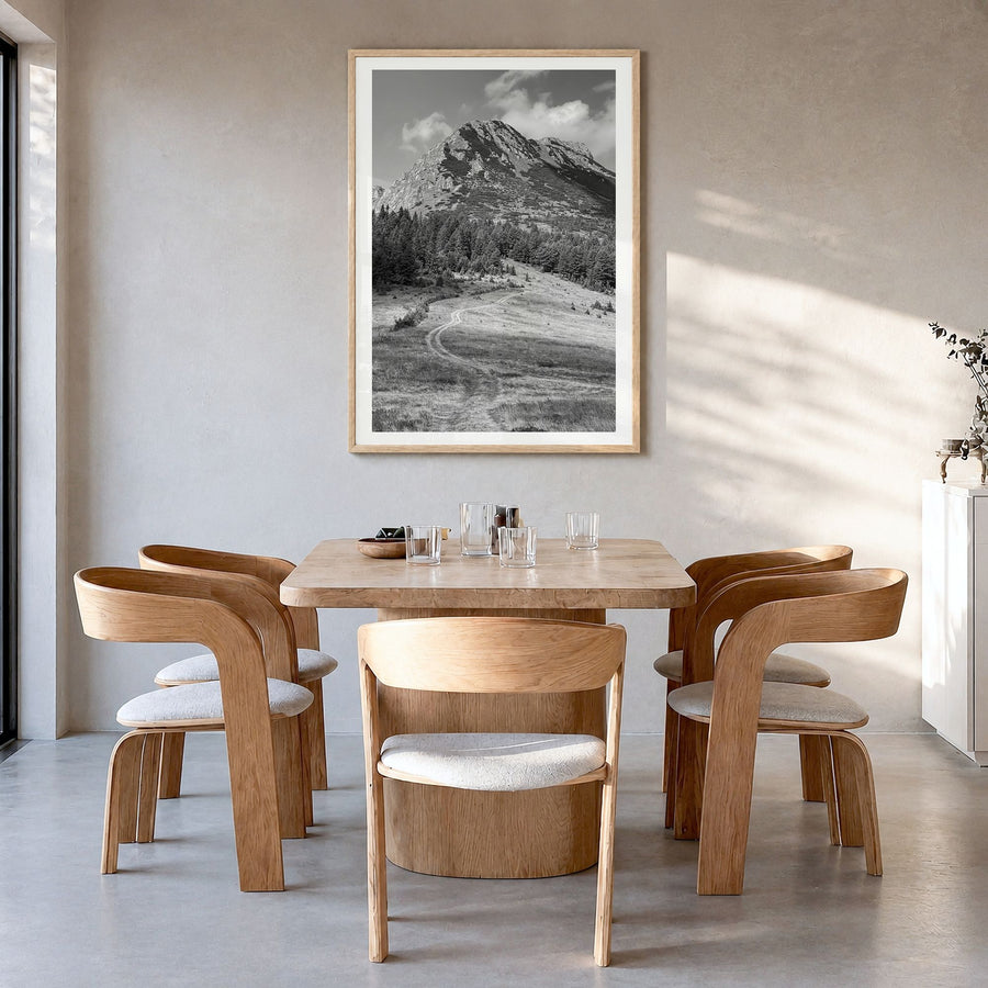 Kosovo Photo Poster in a natural wood frame, hanging in a dining room, white border