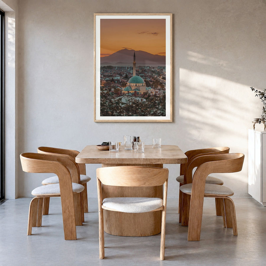 Kosovo Photo Poster in a natural wood frame, hanging in a dining room, white border