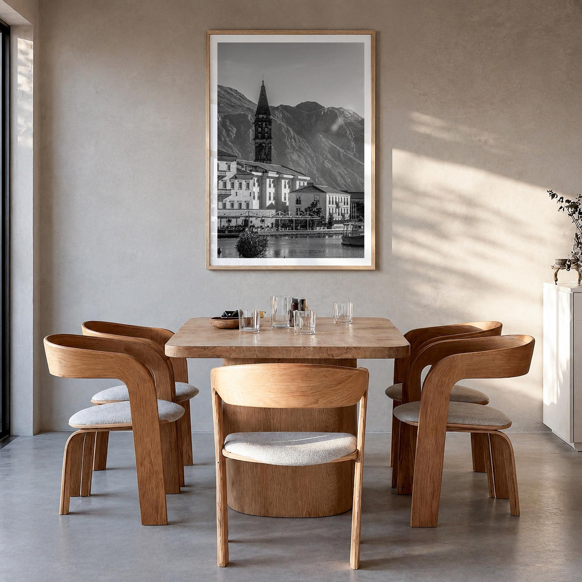 Kotor black & white photo poster of Montenegro – vertical wall art in natural wood frame with white border, hanging on wall