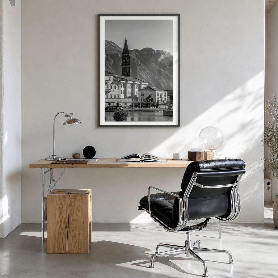 Kotor Photo Poster in a black wood frame, hanging in a bright home office, white border