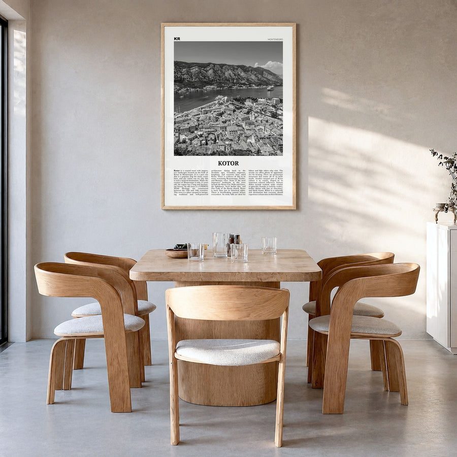 Kotor Newspaper Poster in a natural wood frame, hanging in a dining room
