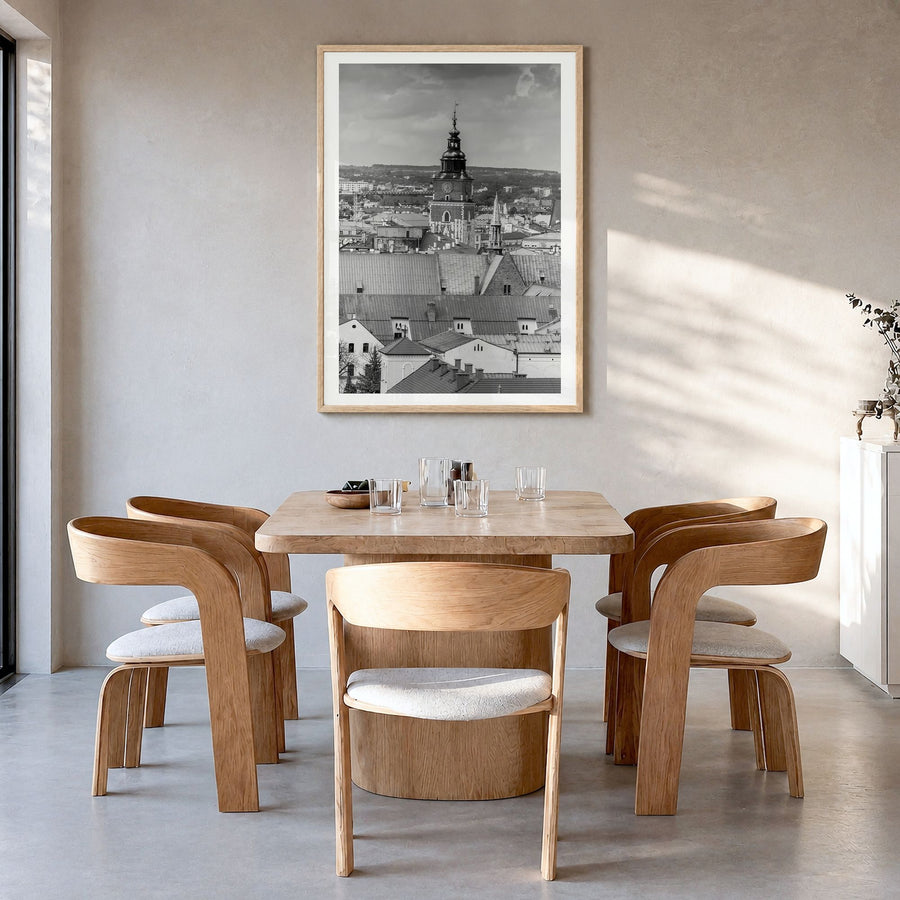 Kraków Photo Poster in a natural wood frame, hanging in a dining room, white border