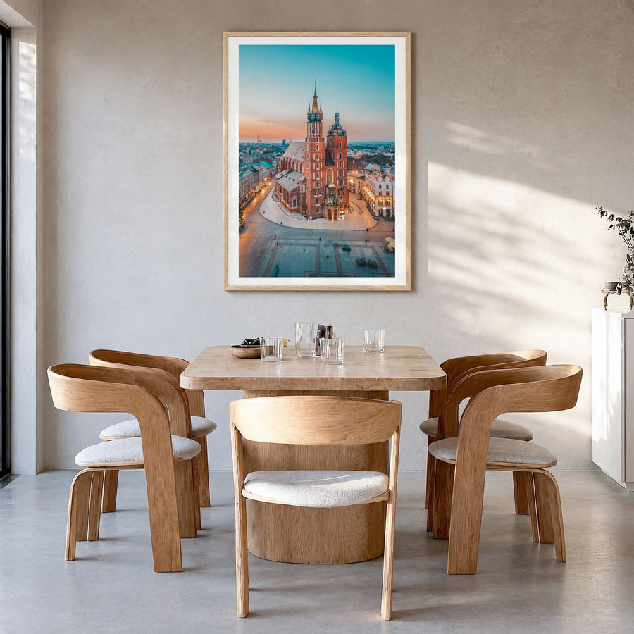 Kraków Photo Poster in a natural wood frame, hanging in a dining room, white border