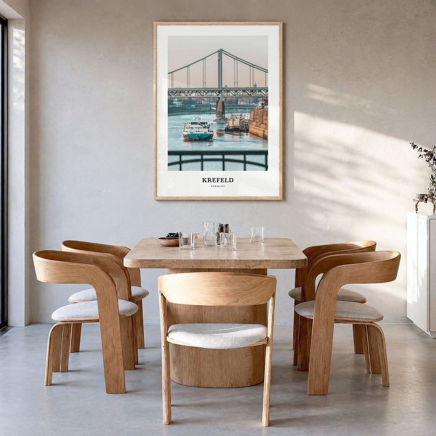Krefeld Classic Poster in a natural wood frame, hanging in a dining room